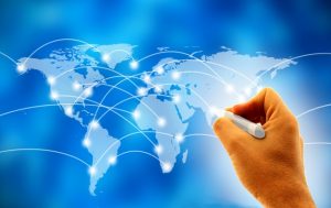 Business man drawing social network or business connections on world map