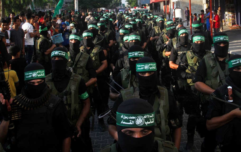 Palestinian Hamas militants take part in a military parade marking the first anniversary of the killing of Hamas's military commanders Mohammed Abu Shammala and Raed al-Attar, in Rafah, southern Gaza Strip, on August 21, 2015. Abu Shammala and al-Attar were killed by in Israeli air strike during a 50-day war between the armed group and Israel last summer. Photo by Abed Rahim Khatib /Flash90