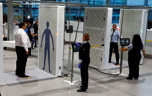 The world's pilot innovative "Easy Security" system for passengers consisting of two full-body scanners and two automated luggage-X-ray lanes are seen during live operations at Cologne-Bonn's Konrad Adenauer Airport in Cologne, Germany, November 17, 2016. REUTERS/Wolfgang Rattay - RTX2U6GK